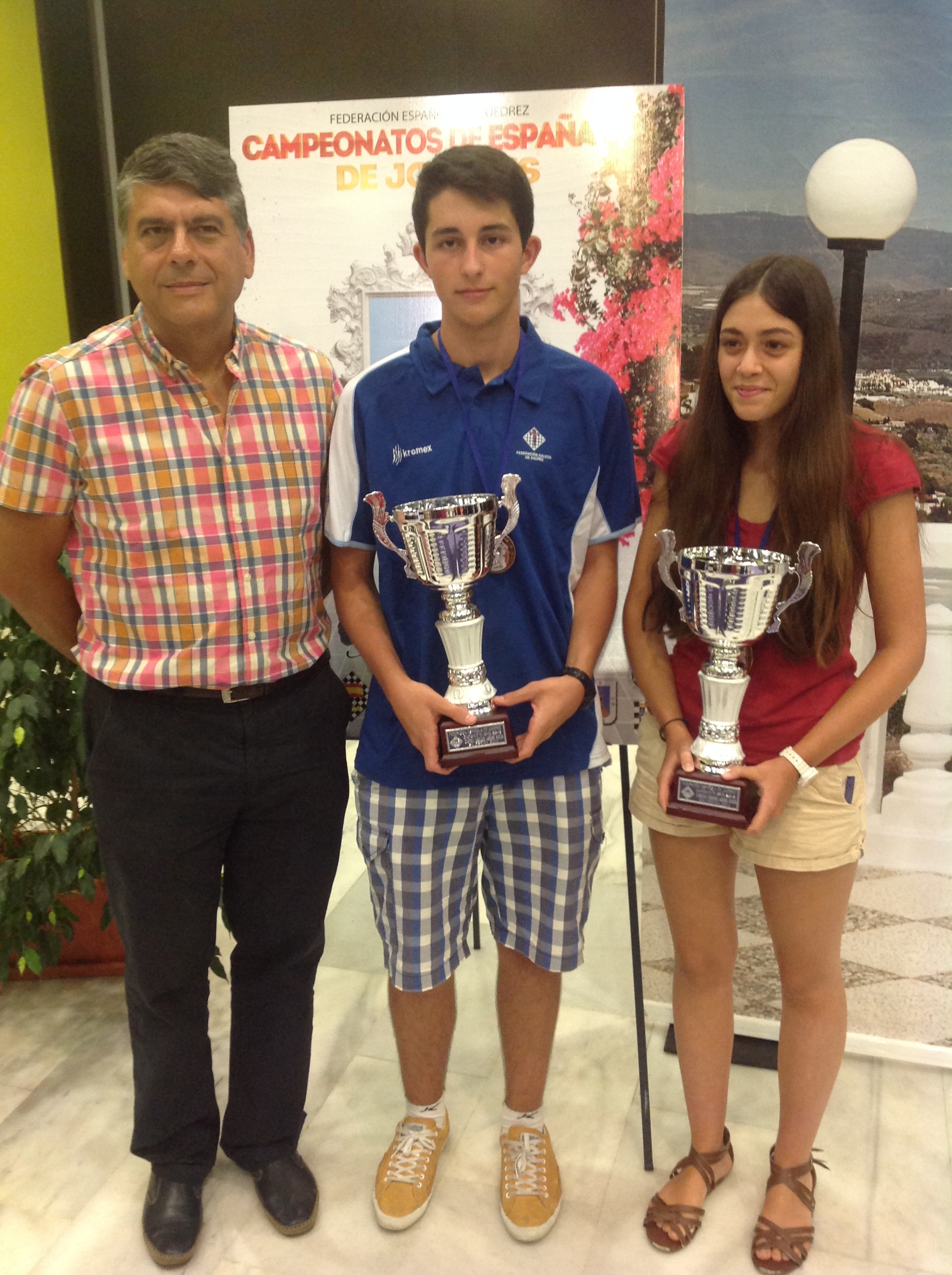 Julio, el presidente Ochoa y la campeona